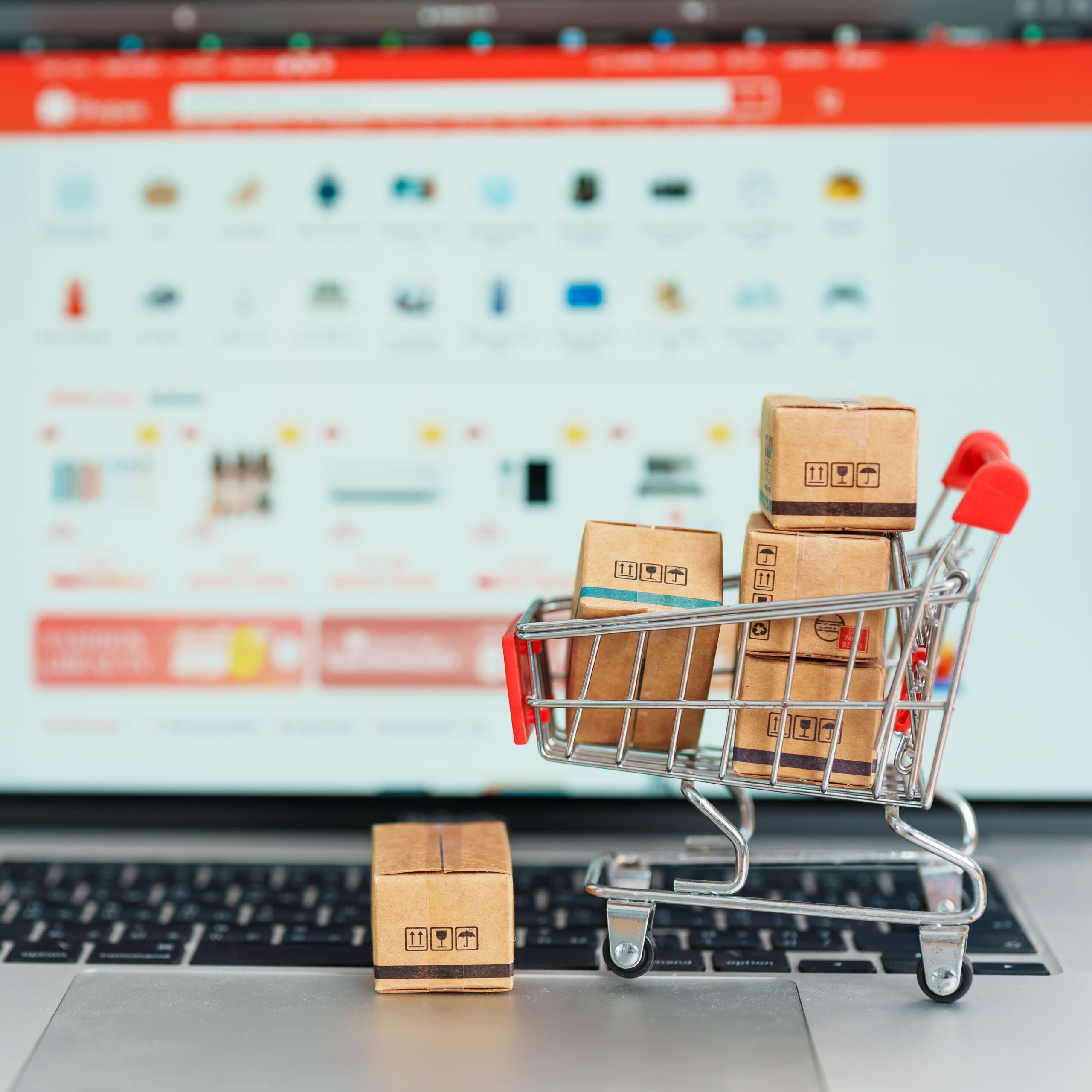 online-shopping-cart-with-delivery-boxes-on-laptop-2026-03-19-10-09-39-utc